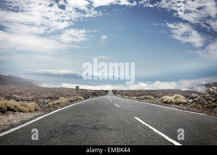 Picture presenting rural landscape with an empty route in the middle Stock Photo