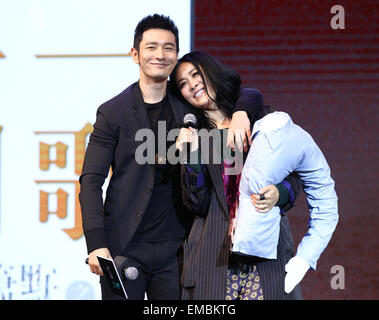 Beijing, China. 19th Apr, 2015. Actor Huang Xiaoming (L) hugs Na Ying at a press conference of the theme song for the movie 'My Sunshine' at Beijing Jiaotong University in Beijing, capital of China, April 19, 2015. © Xinhua/Alamy Live News Stock Photo