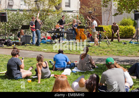Small outdoor rock band performance on college campus - USA Stock Photo