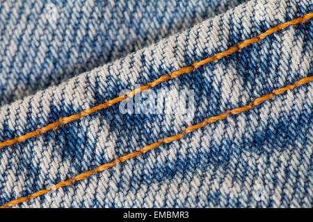 Seam on blue jean denim fabric Stock Photo