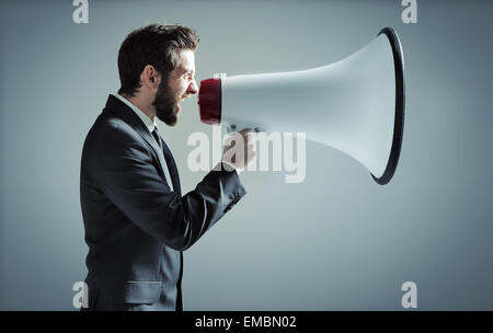 Conceptual photo of manager yelling over the megaphone Stock Photo