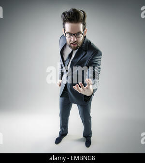 Angry businessman posing in elegant suit Stock Photo