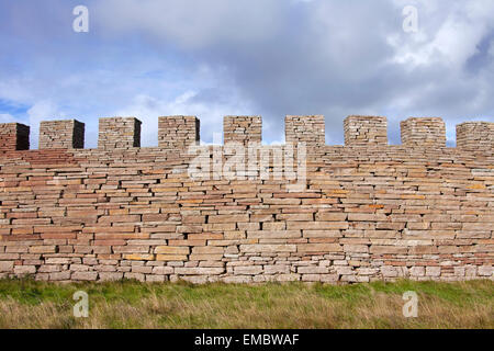 Defensive dry stone wall with crenellation of the Eketorp Castle, Iron Age fort in southeastern Öland, Sweden Stock Photo