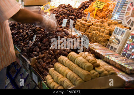 Showing of Turkish sweets, dried fruits and nuts in a stall in the Istanbul spice market Stock Photo