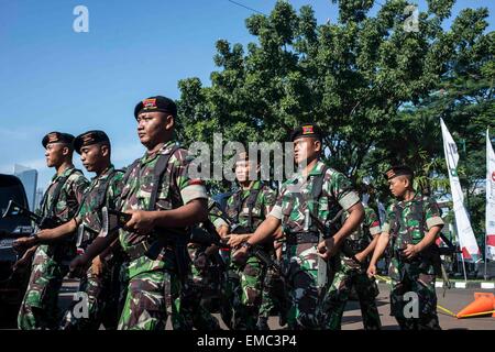 Jakarta, Indonesia. 20th Apr, 2015. Soldiers march outside the Jakarta Convention Center in Jakarta, Indonesia, April 20, 2015. Thousands of soldiers and security force members work for the safety of the Asian-African Conference Commemoration 2015. Credit:  Lui Siu Wai/Xinhua/Alamy Live News Stock Photo