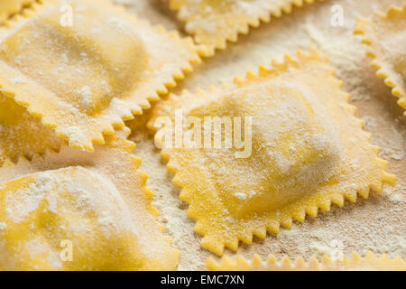 fresh home-made ravioli dusted with flour Stock Photo