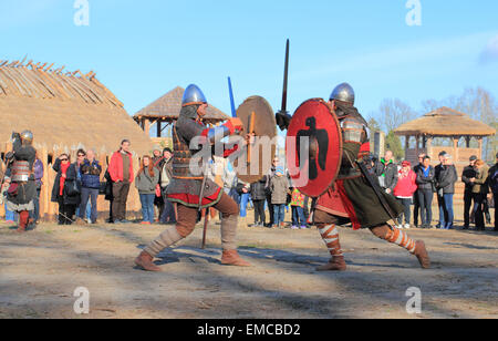 Medieval settlement in Slawutowo. Acting battle with costumed warriors. Pomerania region, Poland. Stock Photo