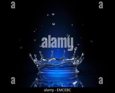 Water splash in blue spot light Stock Photo