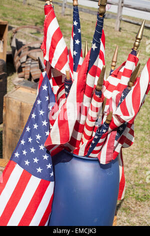 Flags fly in front of a roadside antique store in Vermont on a sunny spring day. Stock Photo