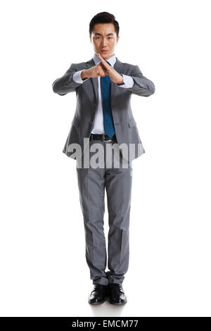 A young business man practicing kung fu Stock Photo