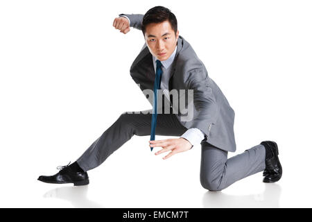 A young business man practicing kung fu Stock Photo
