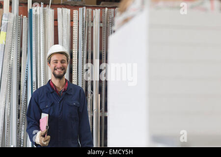 Smiling warehouseman in storehouse Stock Photo