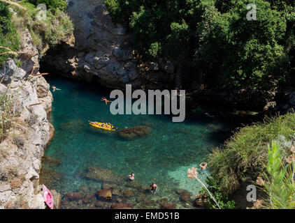 Queen Joan's baths is a natural basin and stone arch to the sea. It is on the site of a Roman villa and is a secret treasure. Stock Photo