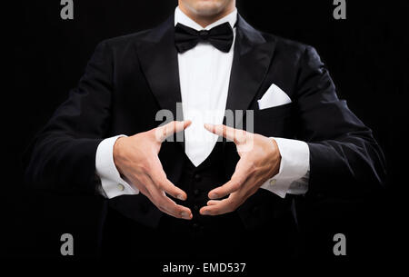 magician showing trick Stock Photo