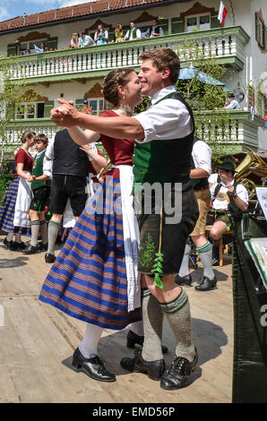 The Schuhplattler is a traditional folk dance popular in the Alpine regions of Bavaria, here on the Market square of Miesbach. Stock Photo