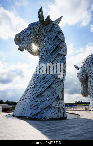 Dramatic daytime shot of the Kelpies statues in Falkirk, Scotland, UK on a sunny day against a blue sky Stock Photo