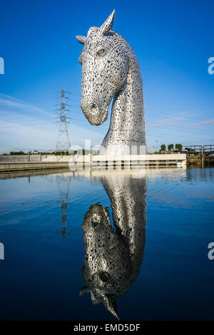 Dramatic daytime shot of the Kelpies statues in Falkirk, Scotland, UK on a sunny day against a blue sky Stock Photo