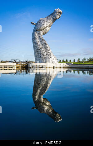 Dramatic daytime shot of the Kelpies statues in Falkirk, Scotland, UK on a sunny day against a blue sky Stock Photo