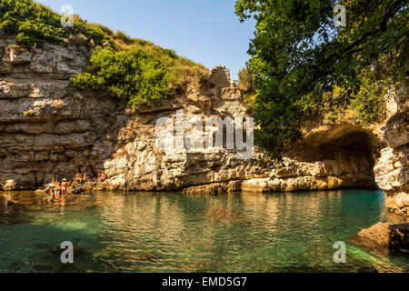 Queen Joan's baths is a natural basin and stone arch to the sea. It is on the site of a Roman villa and is a secret treasure. Stock Photo