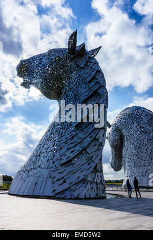 Dramatic daytime shot of the Kelpies horse head statues sculpture in Falkirk, Scotland, UK on a sunny day against a blue sky Stock Photo