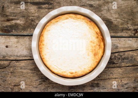 Fresh baked cheesecake on wooden table. Top view image dessert cooking background Stock Photo