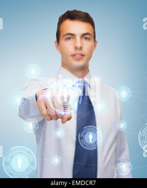 buisnessman pointing finger to virtual screen Stock Photo