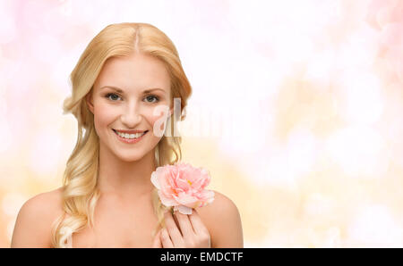 smiling woman with peony flower Stock Photo