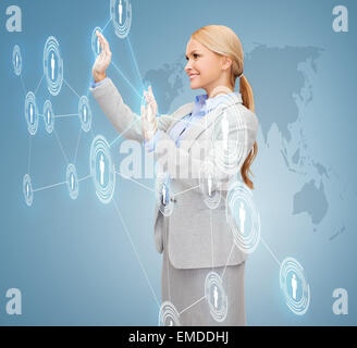 smiling businesswoman working with virtual screen Stock Photo