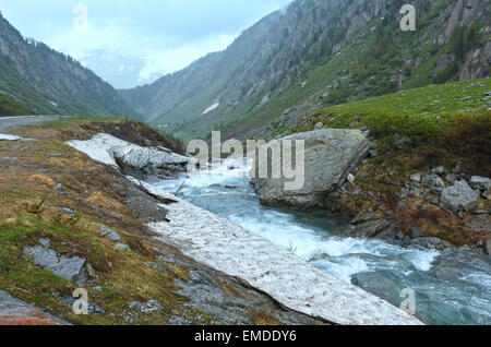 Passo del San Gottardo or St. Gotthard Pass summer misty landscape (Switzerland).  Rainy weather. Stock Photo