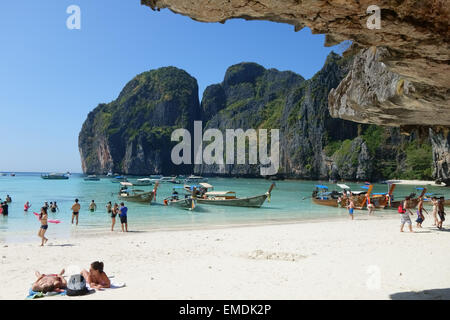 Boats, tourists, sand and sea on tropical Maya Beach, Koh Phi Phi Leh, looking out to the Andaman Sea, Krabi Province, Thailand, Stock Photo