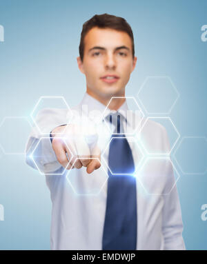 buisnessman pointing finger to virtual screen Stock Photo