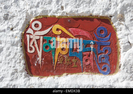 The Sanskrit mantra 'Om mani padme hum' inscribed and painted as a mani stone on a recess in a wall of the Potala Palace in Lhas Stock Photo