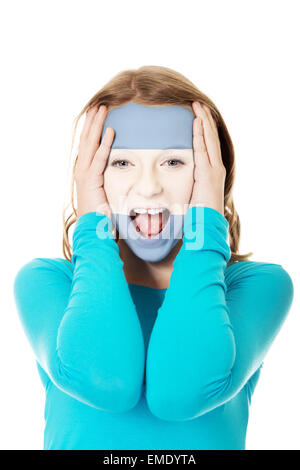 Woman with the argentinean flag on face. Stock Photo