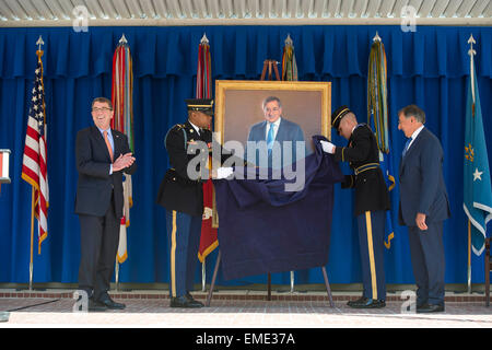 US Defense Secretary Ashton Carter and Former Secretary of Defense Leon Panetta watch as Panetta's official portrait is unveiled at the Pentagon April 16, 2015 in Arlington, Virginia. Panetta served as the 23rd Secretary of Defense from 2011-2013. Stock Photo