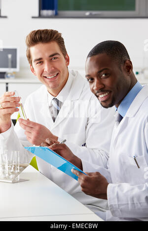 Two Technicians Working In Laboratory Stock Photo