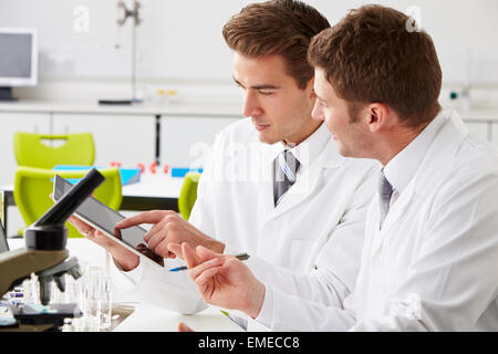Two Technicians Working In Laboratory Stock Photo