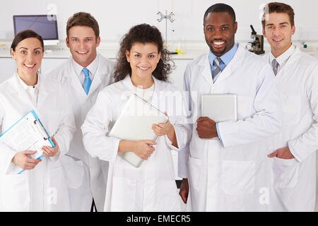 Portrait Of Laboratory Technicians Standing In Group Stock Photo