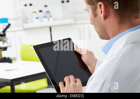 Scientist In Laboratory Using Digital Tablet Stock Photo