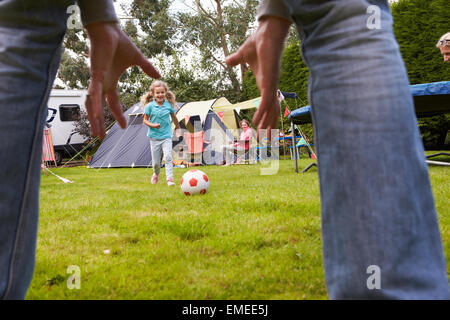 Family Having Football Match On Camping Holiday Stock Photo