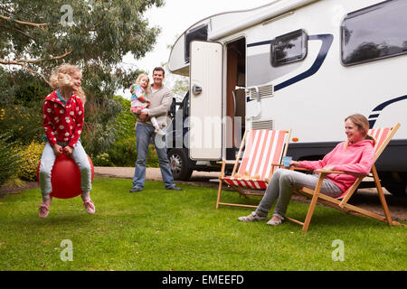 Family Enjoying Camping Holiday In Camper Van Stock Photo