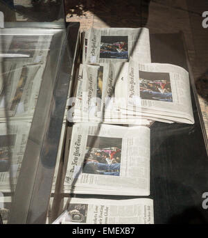 Home delivery copies of the New York Times, containing some of the Sunday sections, are seen in an apartment building lobby in New York on Saturday, April 18, 2015 (© Richard B. Levine) Stock Photo