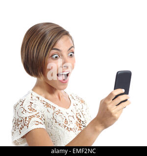 Happy woman surprised looking her smart phone isolated on a white background Stock Photo