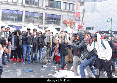 Toronto, Canada. 20th Apr, 2015. People taking photographs of a man in yonge dundas square in toronto. Credit:  NISARGMEDIA/Alamy Live News Stock Photo