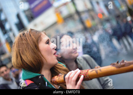 Toronto, Canada. 20th Apr, 2015. Girl smoking in yonge dundas square in toronto. Credit:  NISARGMEDIA/Alamy Live News Stock Photo