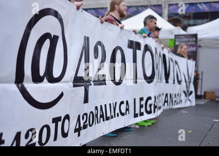 Toronto, Canada. 20th Apr, 2015. People holding banner of 420 Toronto  rally in Dundas square in Toronto. Credit:  NISARGMEDIA/Alamy Live News Stock Photo