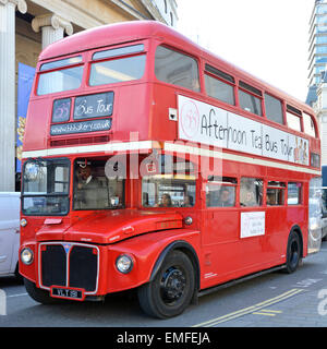 Classic original red historical routemaster double decker bus adapted for use as afternoon tea & sightseeing tour Trafalgar Square London England UK Stock Photo