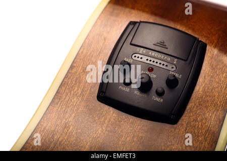 Color detail shot of an acoustic guitar equalizer. Stock Photo