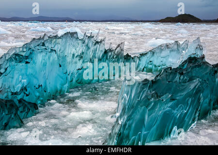 Dense, green amorphus glacial ice floating in Laguna San Rafael near the San Rafael Glacier in southern Chile Stock Photo