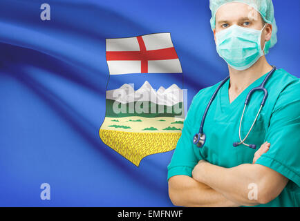 Surgeon with Canadian privinces flag on background - Alberta Stock Photo