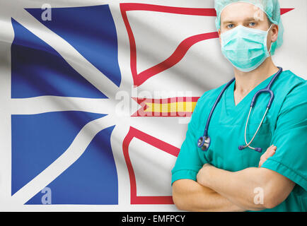 Surgeon with Canadian privinces flag on background - Newfoundland and Labrador Stock Photo